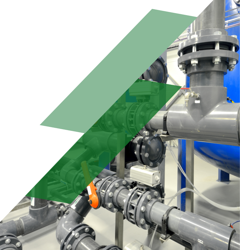 Commercial HVAC pump control system with industrial piping, valves, and automation equipment used to regulate building heating, cooling, and refrigeration operations.